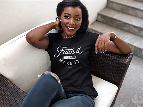 Lady in chair in Blk Faith It Tee